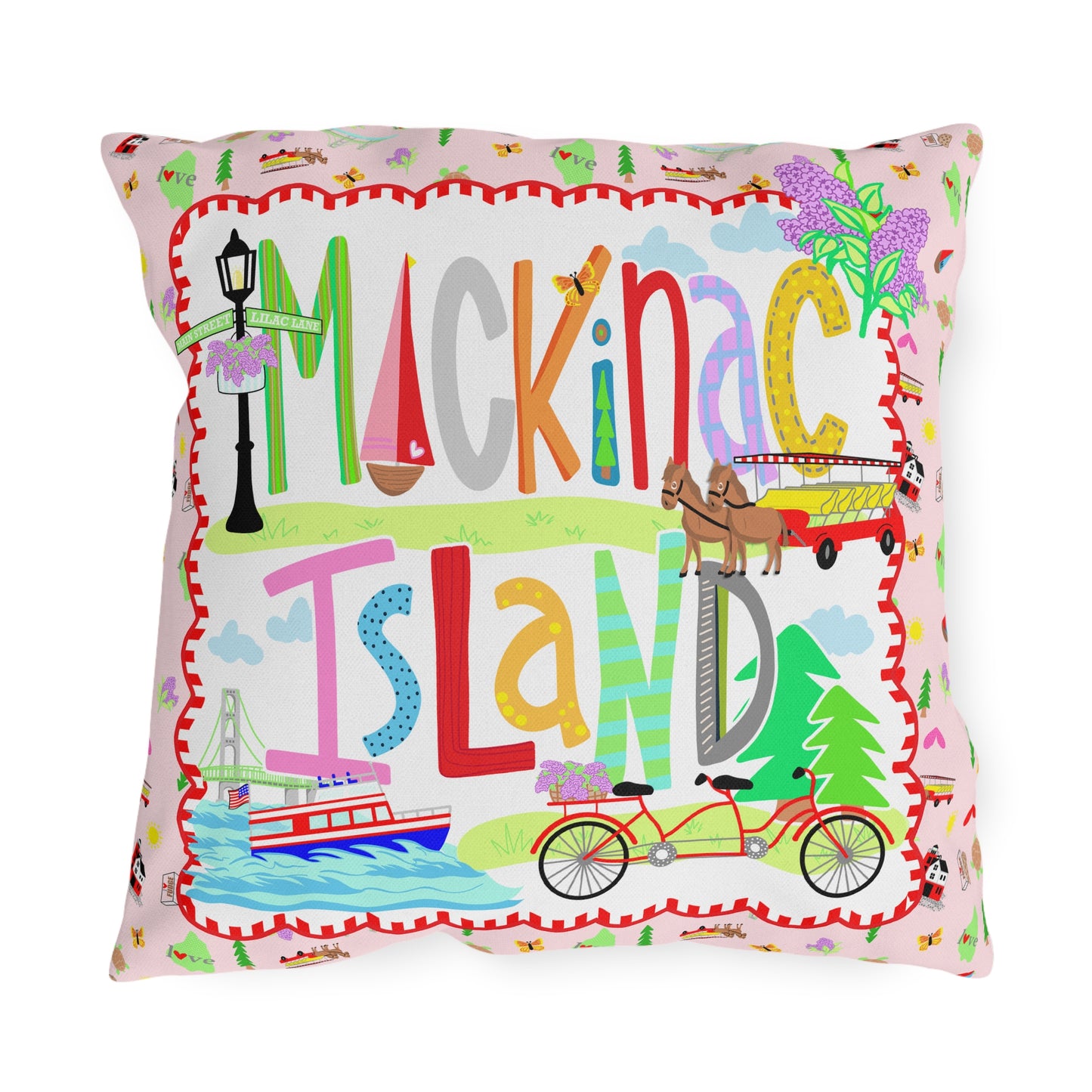 Colorful Mackinac Island outdoor throw pillow featuring whimsical Michigan artwork with bicycles, horse-drawn carriage, ferry, lilacs, and pink cottage design