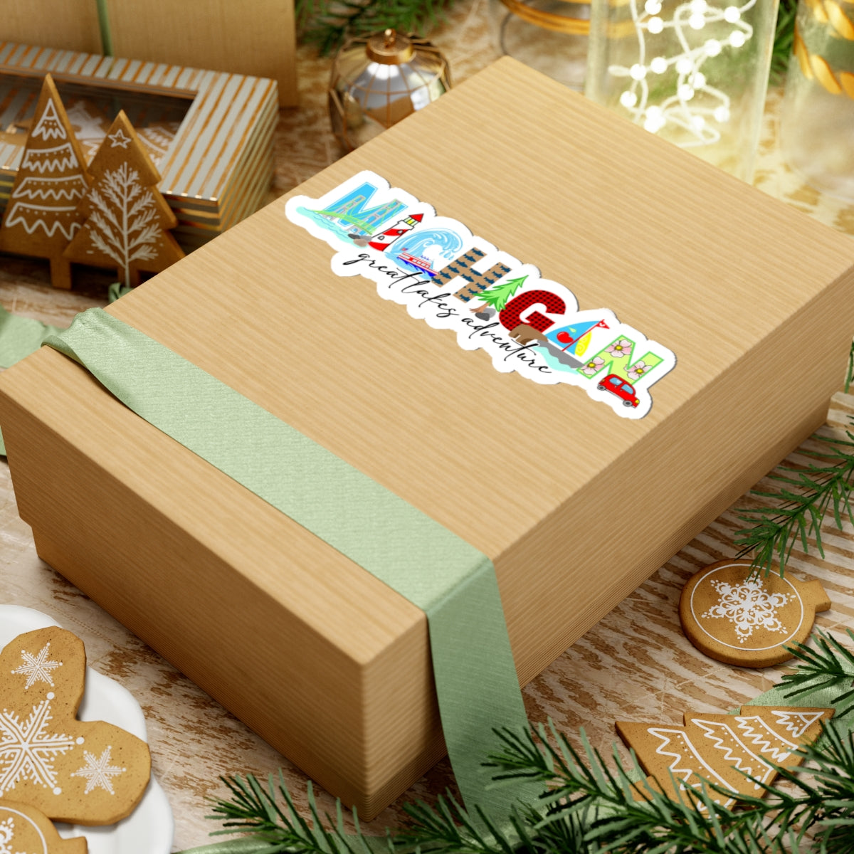 Wooden box with a green ribbon and 'resting gym face' sticker on a festive background with cookies and lights.