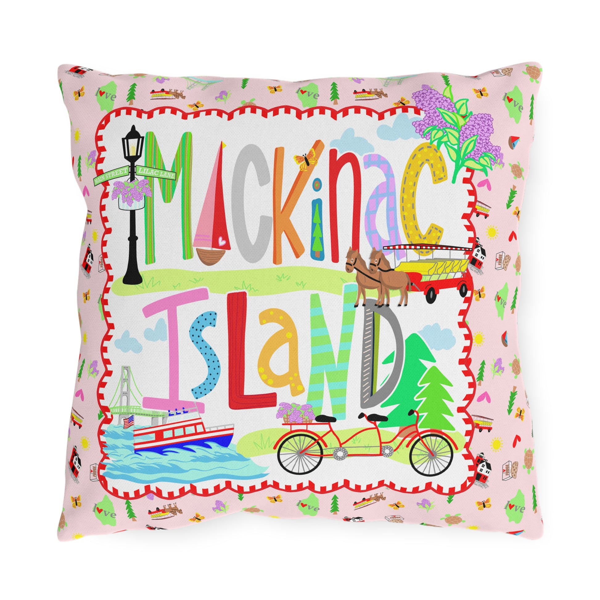 Colorful Mackinac Island outdoor throw pillow featuring whimsical Michigan artwork with bicycles, horse-drawn carriage, ferry, lilacs, and pink cottage design