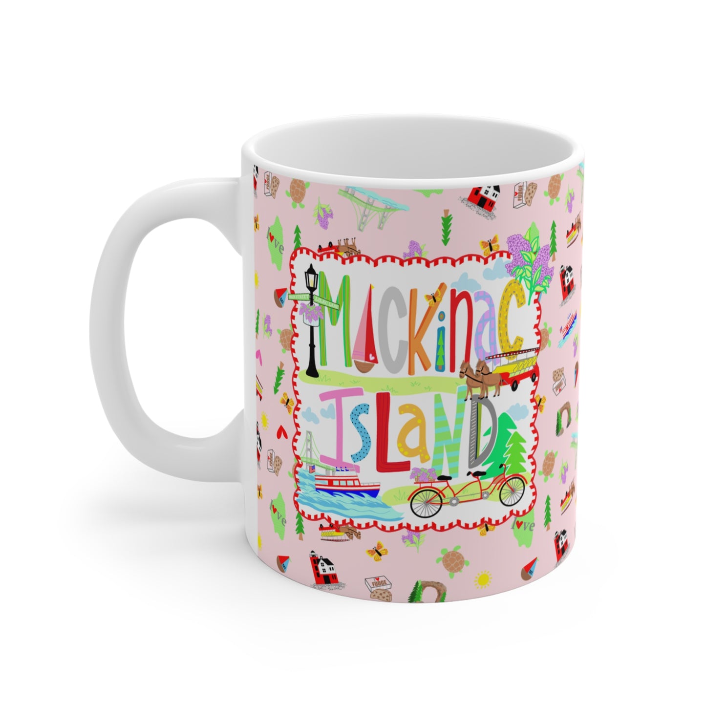 Colorful Mackinac Island mug with whimsical hand-drawn Michigan artwork including a tandem bicycle, horse-drawn carriage, ferry, Grand Hotel and lilacs.
