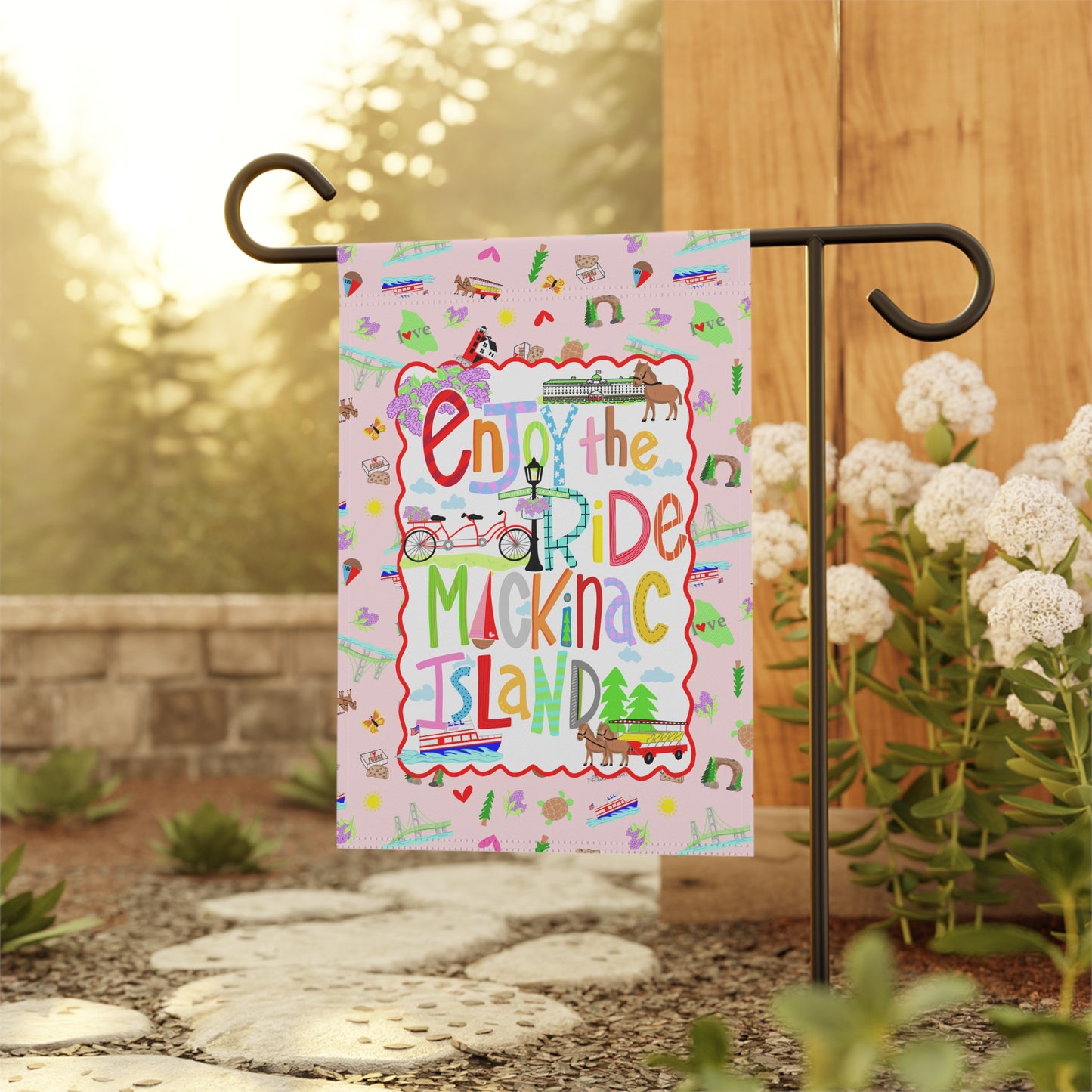 Decorative outdoor garden flag celebrating Mackinac Island bicycles, horse-drawn carriages, and lakeside charm.